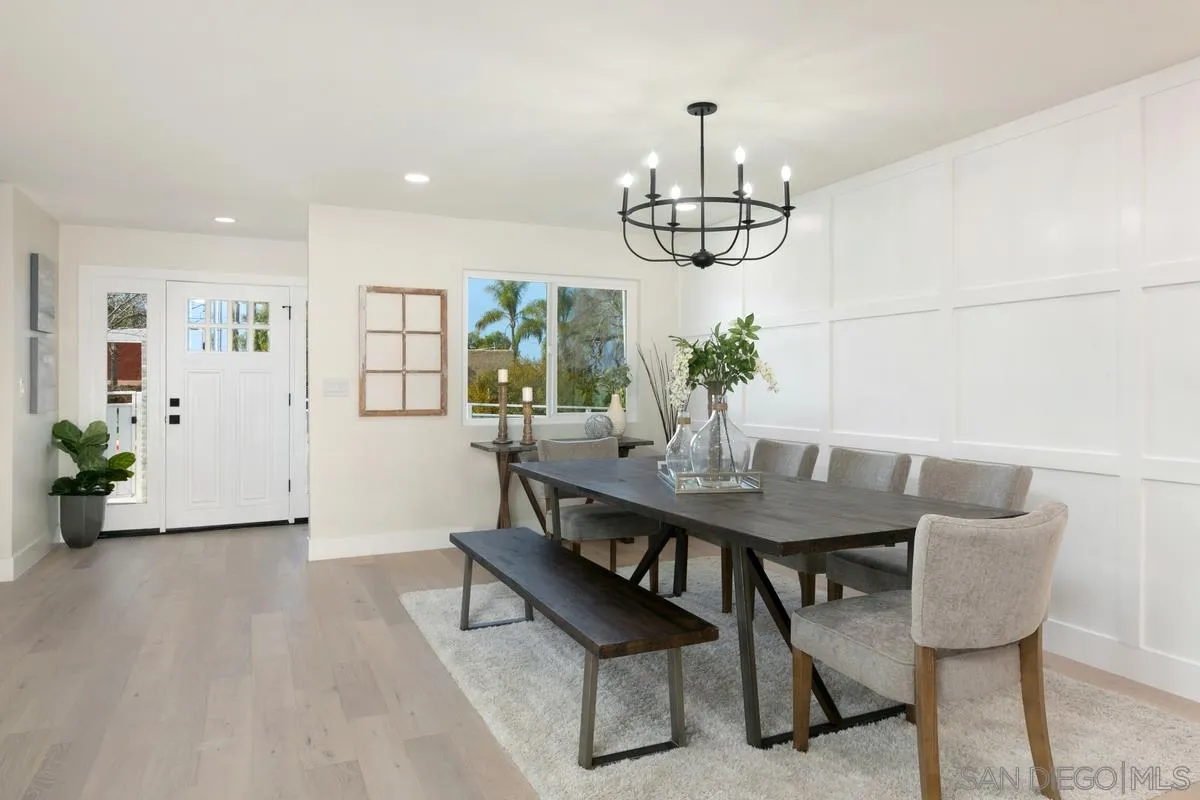 853 Regal Road Encinitas, CA 92024 - Photo 17 of 34 a view of a dining room with furniture window and wooden floor