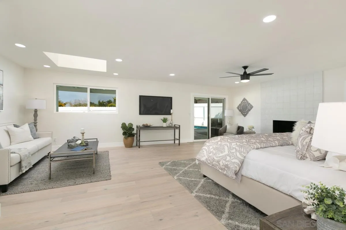 853 Regal Road Encinitas, CA 92024 - Photo 25 of 34 a bedroom with a bed and couch