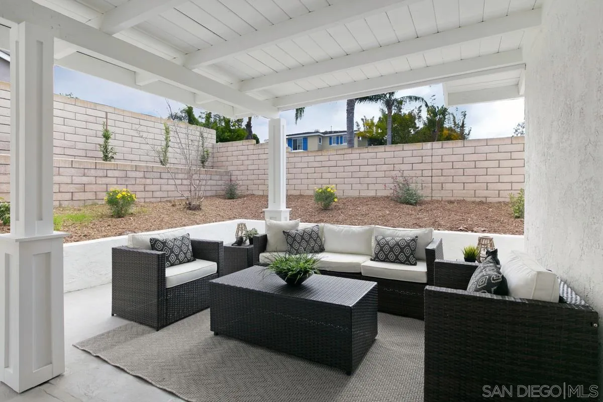 853 Regal Road Encinitas, CA 92024 - Photo 34 of 34 a living room with furniture and a potted plant