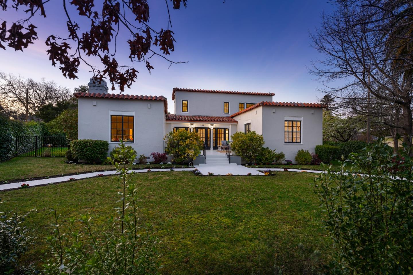 198 Warren Road San Mateo, CA 94401 - Photo 1 of 1 a front view of a house with a yard and garage