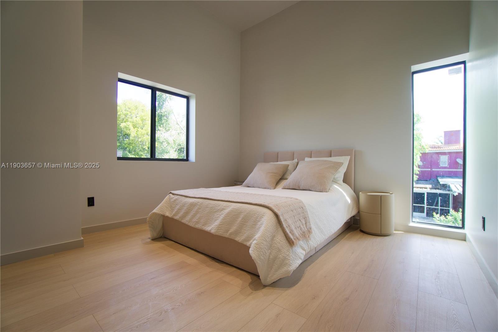 1820 Southwest 10th Street Miami, FL 33135 - Photo 12 of 13 a spacious bedroom with a bed and a window