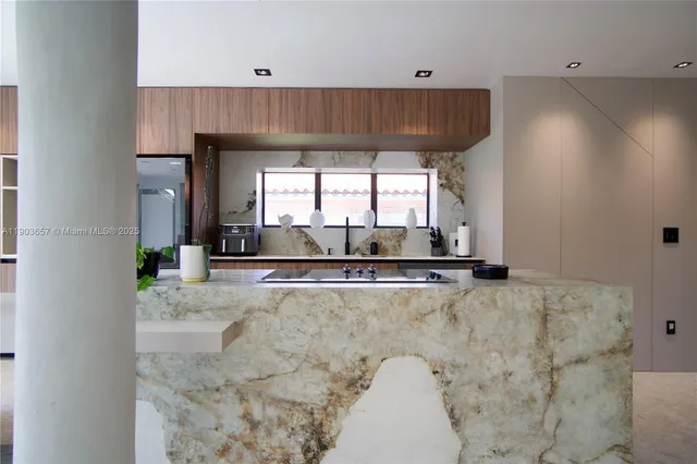 a view of a kitchen with a sink and cabinets