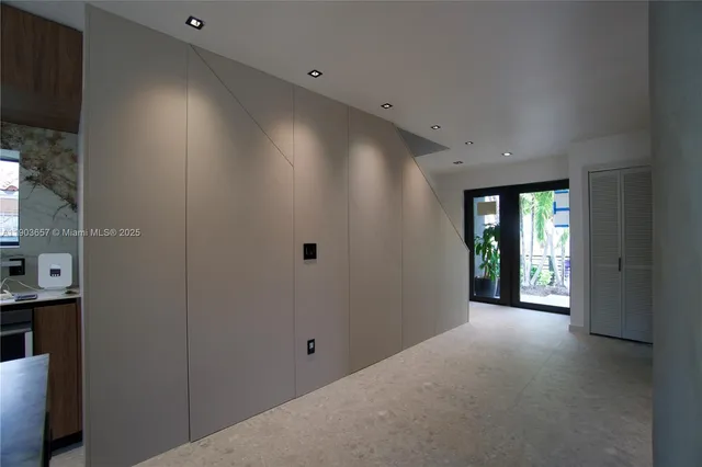 a bathroom with a bathtub sink and mirror