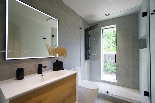 a view of living room with furniture and window