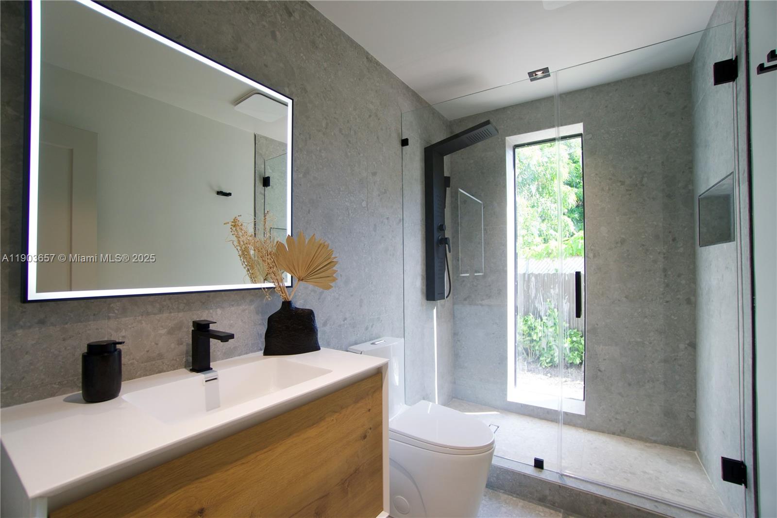 1820 Southwest 10th Street Miami, FL 33135 - Photo 8 of 13 a bathroom with a bathtub sink and mirror