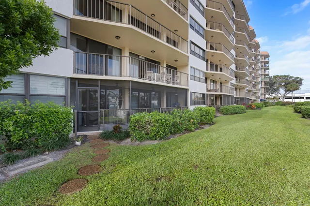 a view of an apartment with a garden