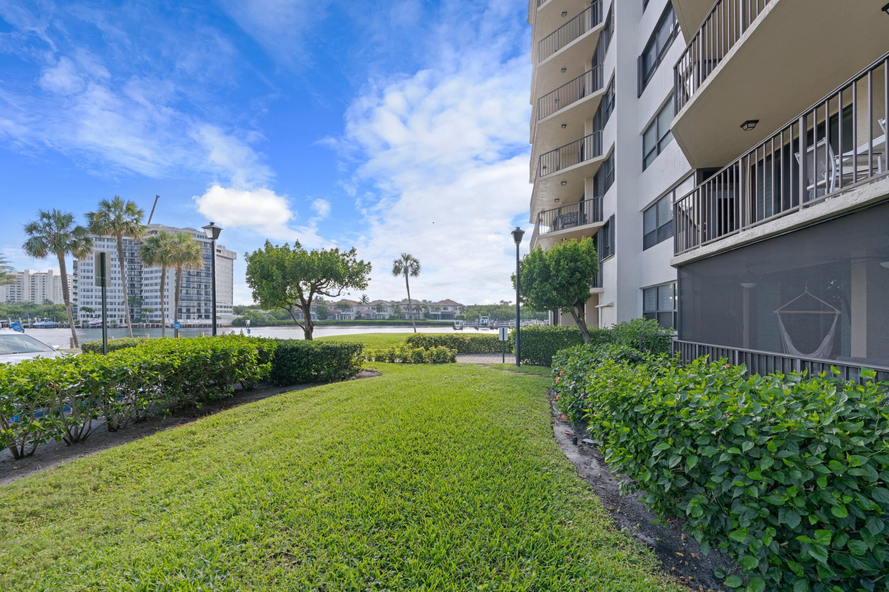 899 Jeffery Street, Unit 112 Boca Raton, FL 33487 - Photo 12 of 33 a view of a garden with a building in the background