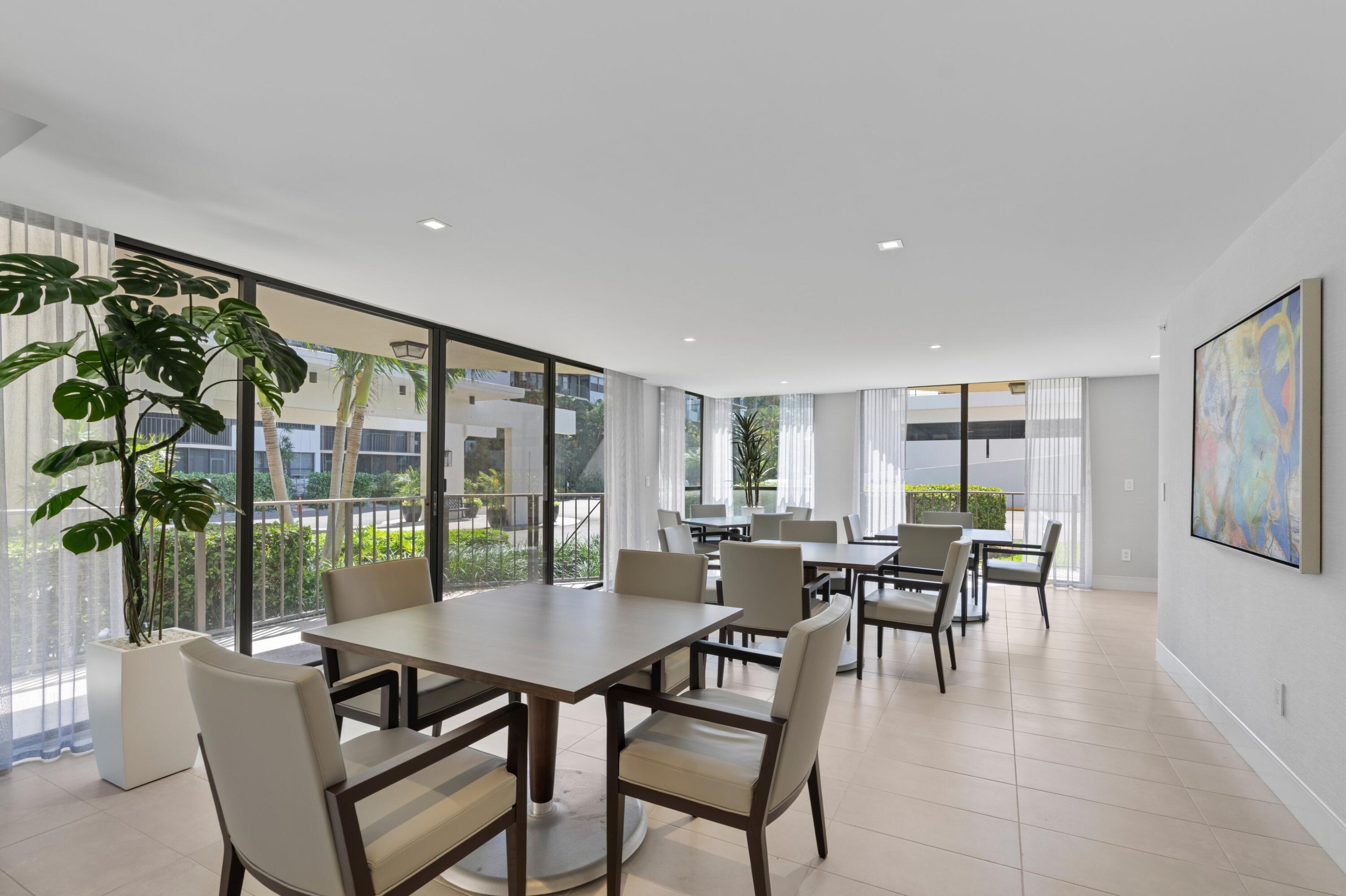 899 Jeffery Street, Unit 112 Boca Raton, FL 33487 - Photo 22 of 33 a dining room with furniture and wooden floor