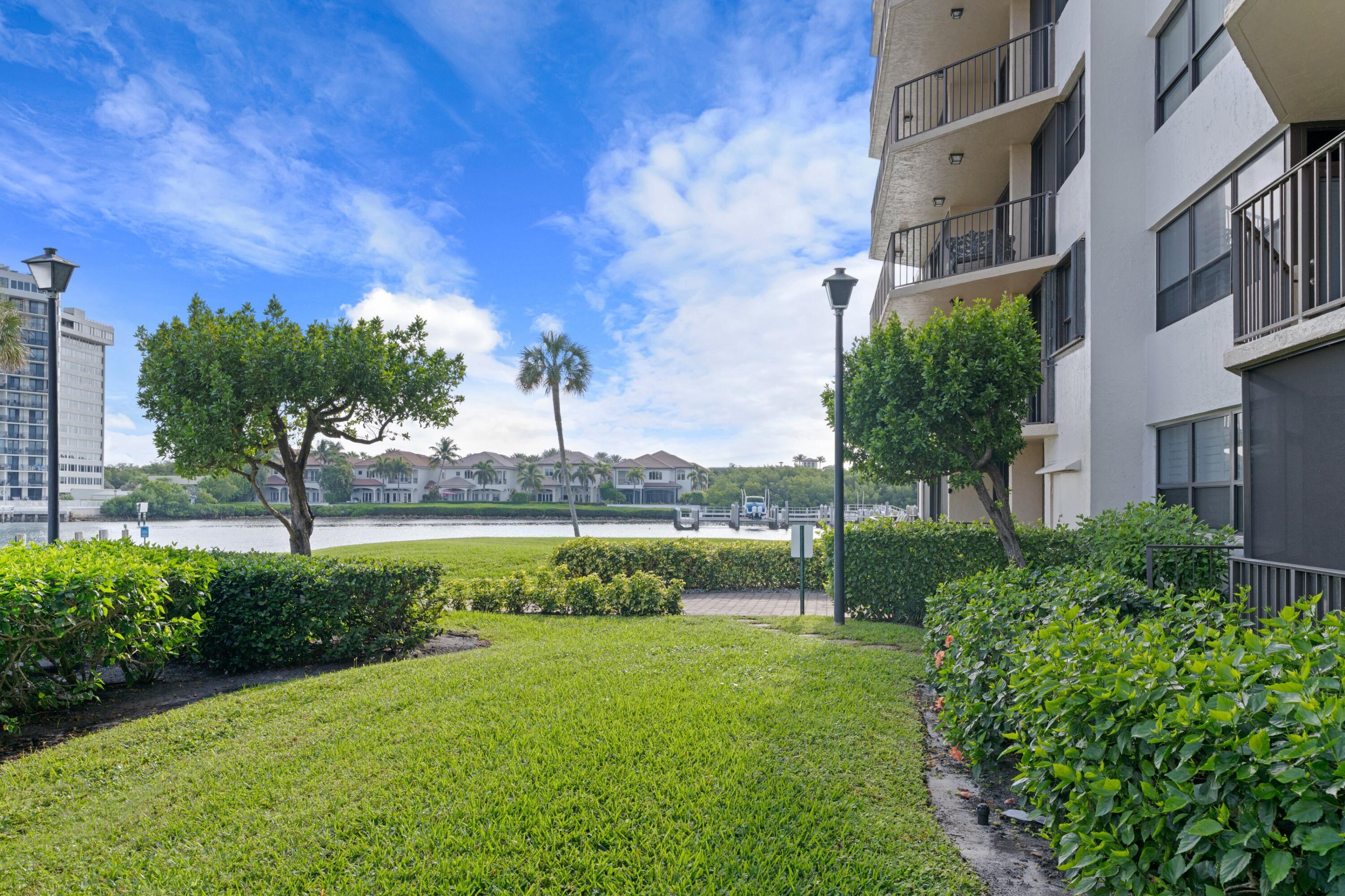 899 Jeffery Street, Unit 112 Boca Raton, FL 33487 - Photo 9 of 33 a view of lake with a yard