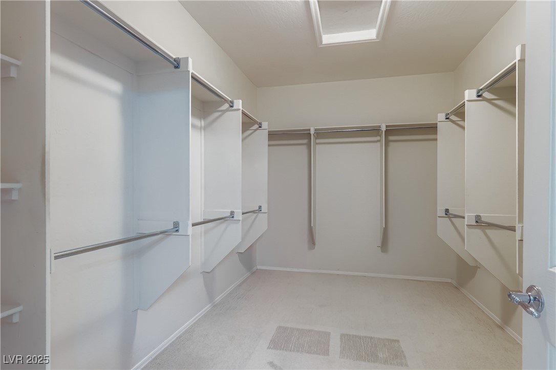 2610 Anani Road Henderson, NV 89044 - Photo 20 of 28 Walk in closet featuring light carpet