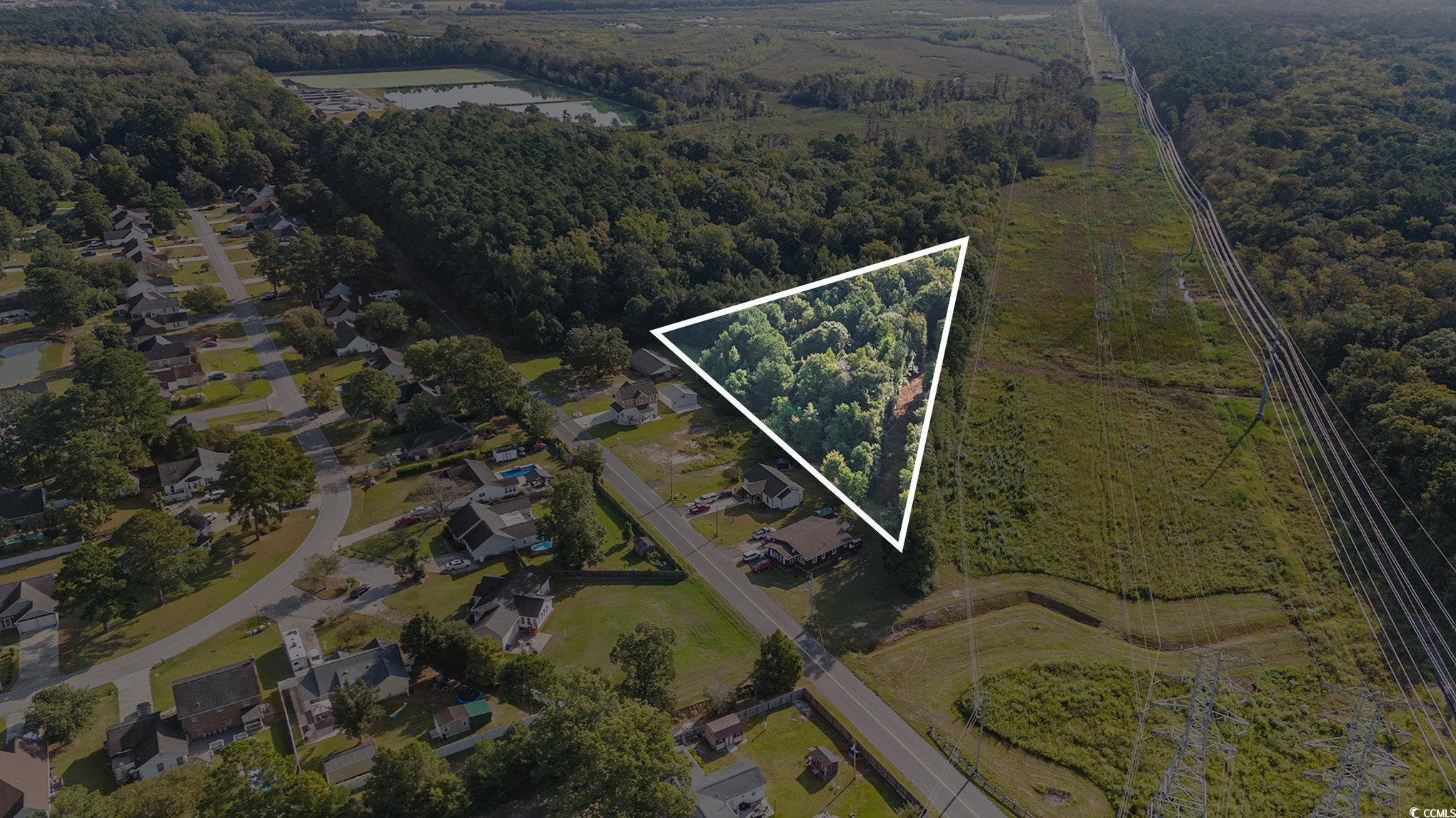 Tbd New Road Conway, SC 29527 - Photo 3 of 10 Aerial view of property's location featuring property parcel outlined and a forest