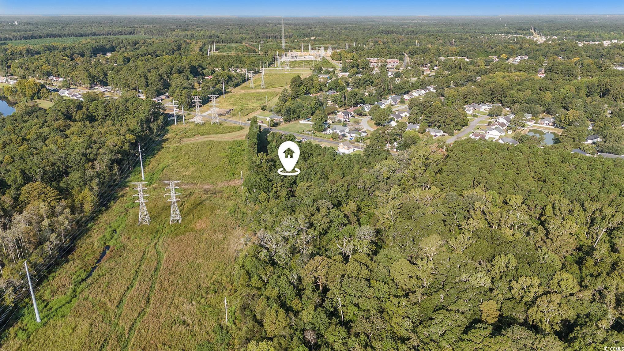 Tbd New Road Conway, SC 29527 - Photo 9 of 10 Aerial view of property and surrounding area featuring a heavily wooded area