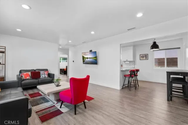 a living room with furniture rug and window