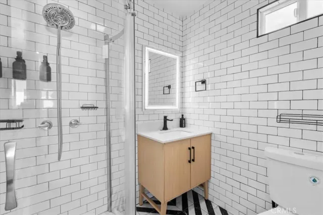 a bedroom with a bed and a desk