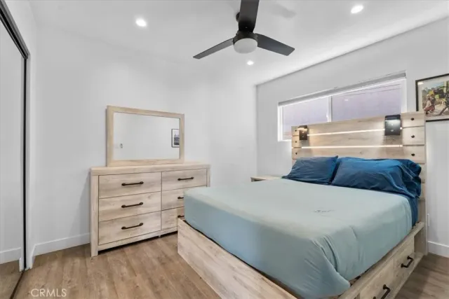 a bedroom with a bed and a dresser