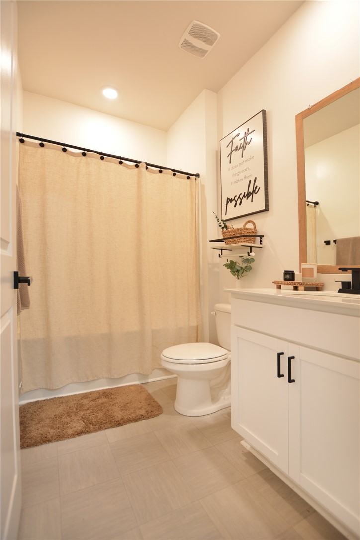 242 Hillendale Way Pelzer, SC 29669 - Photo 6 of 19 This bright bathroom features a spacious shower and sleek vanity, perfect for daily routines.