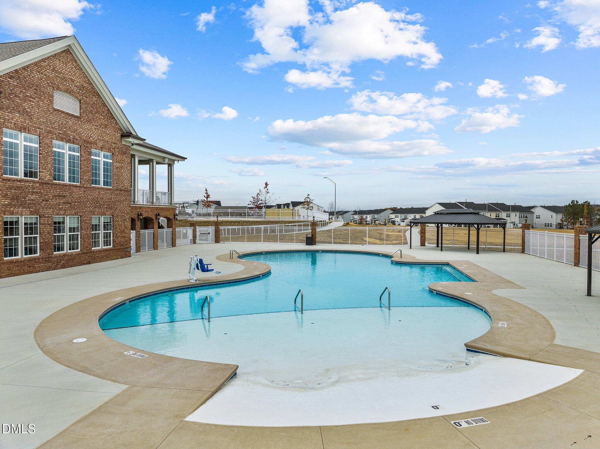 2202 Kasota Lane Raleigh, NC 27610 - Photo 18 of 79 a view of a swimming pool with an outdoor seating