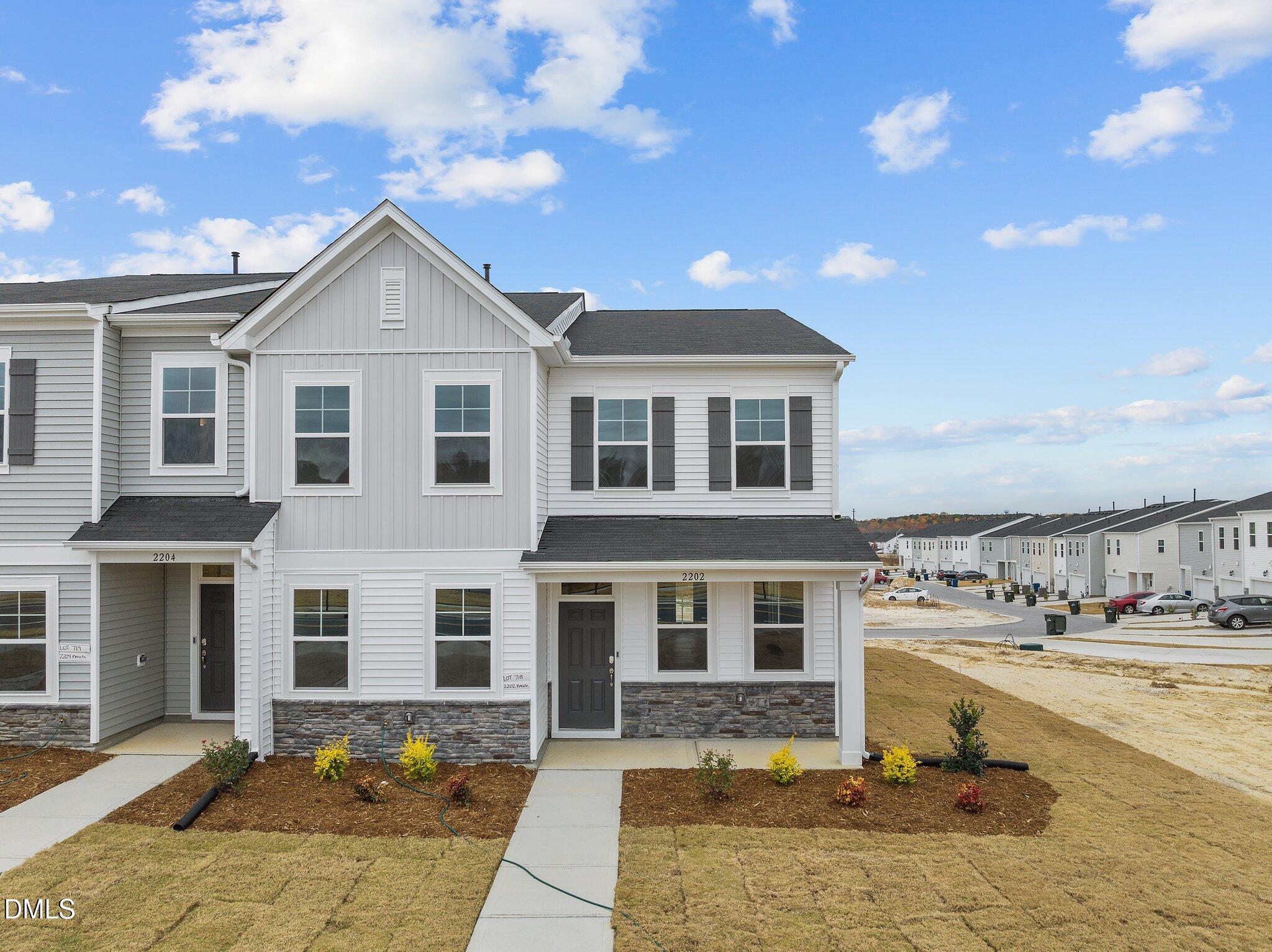 2202 Kasota Lane Raleigh, NC 27610 - Photo 2 of 79 a front view of a house with a yard