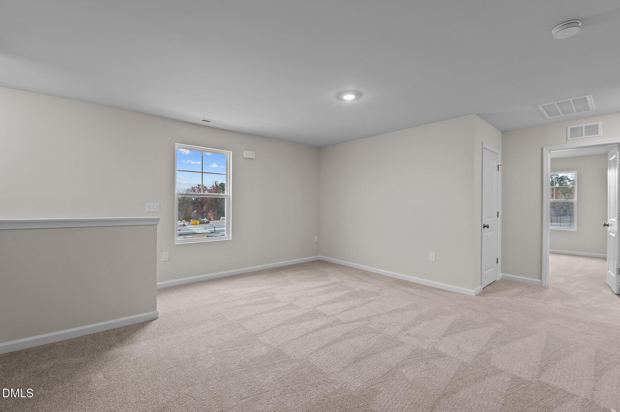 2202 Kasota Lane Raleigh, NC 27610 - Photo 33 of 79 an empty room with windows