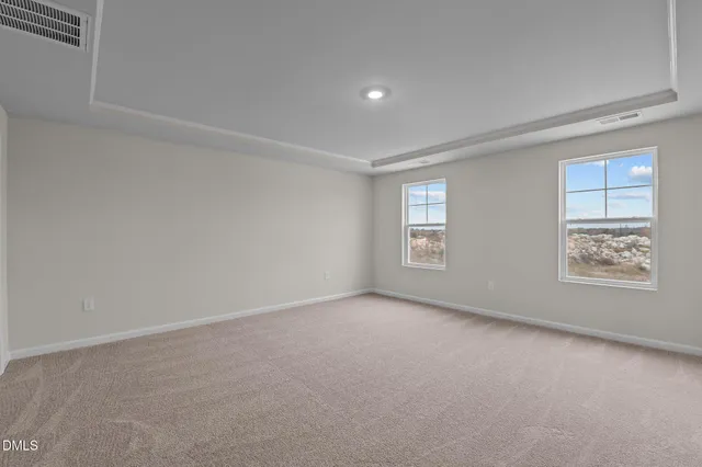 a view of a brick house with a large windows