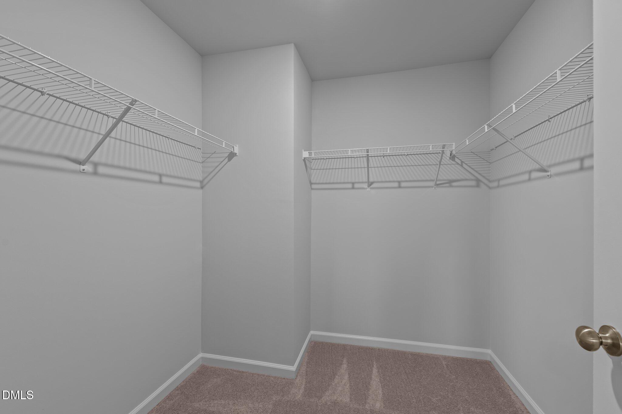 2202 Kasota Lane Raleigh, NC 27610 - Photo 36 of 79 a view of storage and utility room with racks on the wall