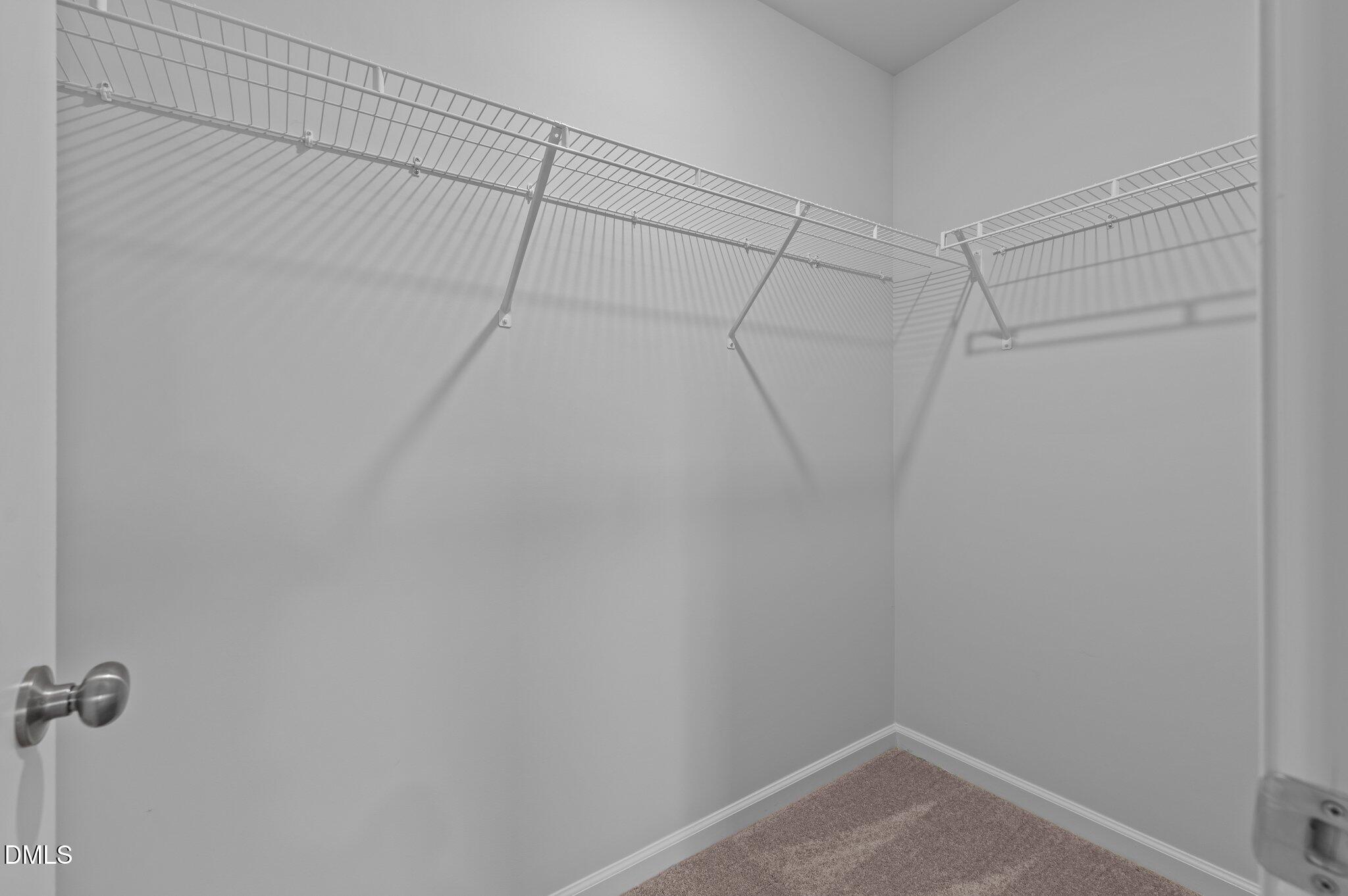 2202 Kasota Lane Raleigh, NC 27610 - Photo 42 of 79 a view of a room with racks on the wall