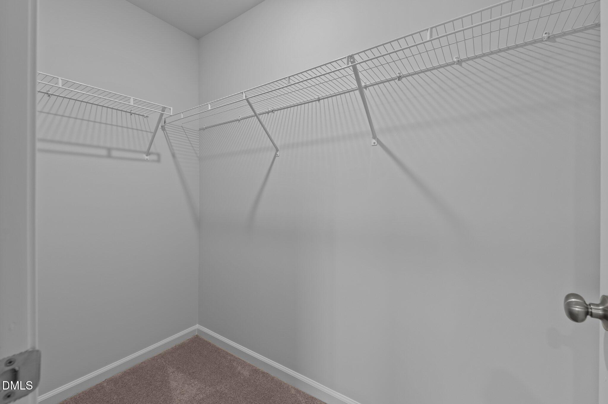 2202 Kasota Lane Raleigh, NC 27610 - Photo 47 of 79 a view of a room with racks on the wall