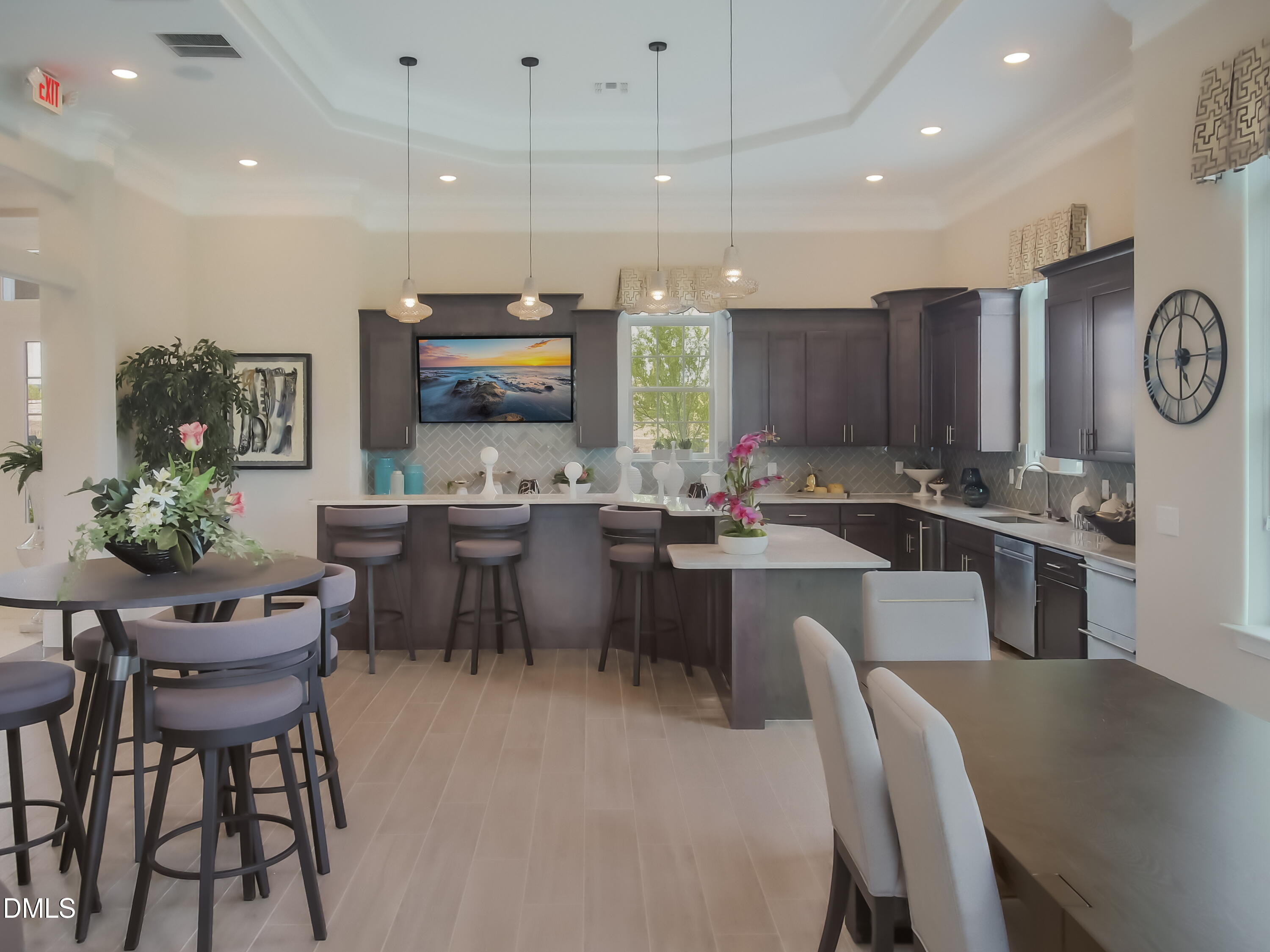 2202 Kasota Lane Raleigh, NC 27610 - Photo 54 of 79 a kitchen with a table chairs refrigerator and microwave