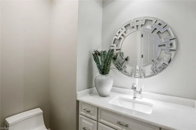 a close view of light fixtures and wooden floor