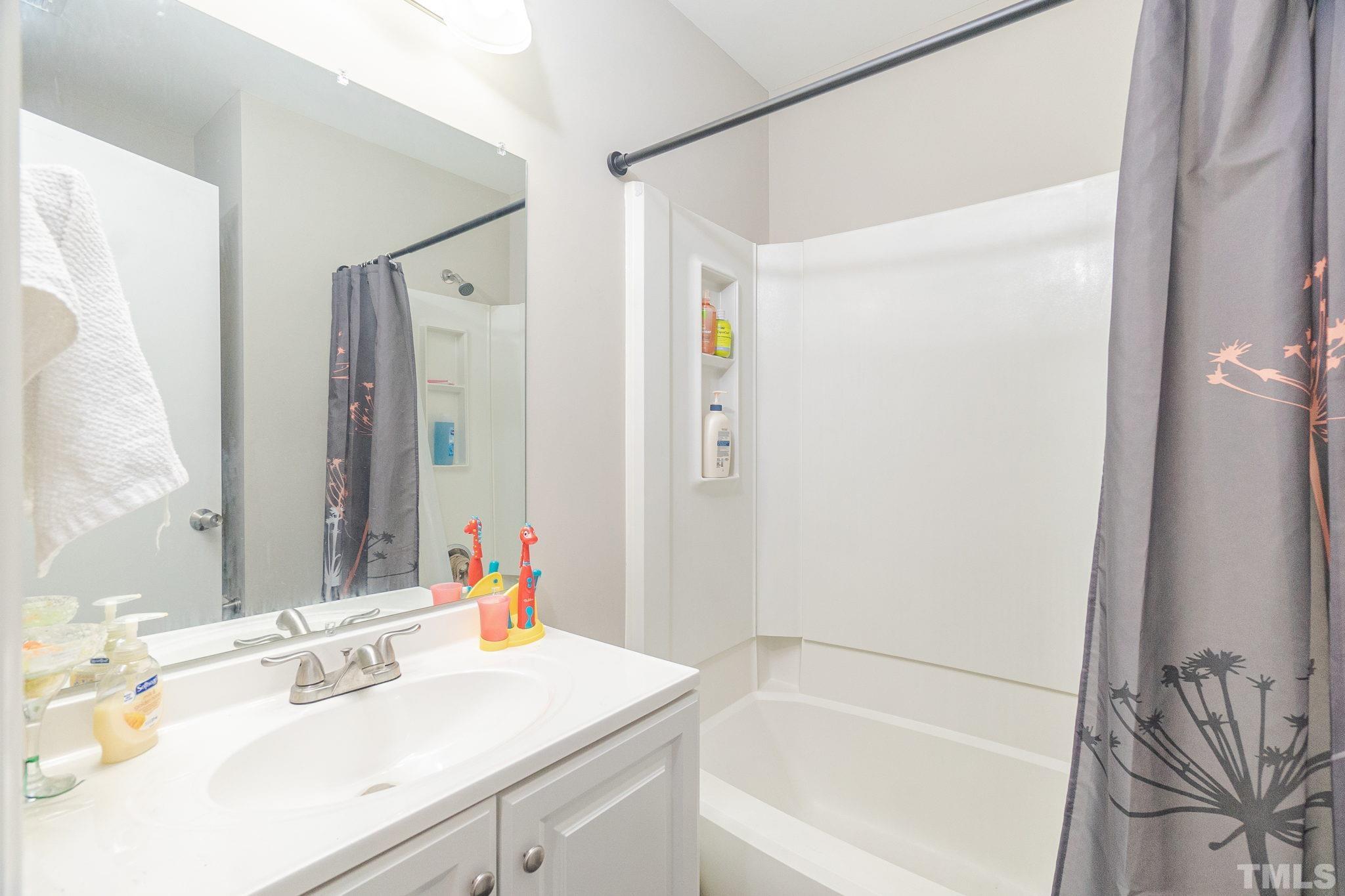 133 Bashford Road Raleigh, NC 27606 - Photo 12 of 45 a bathroom with a sink and a mirror