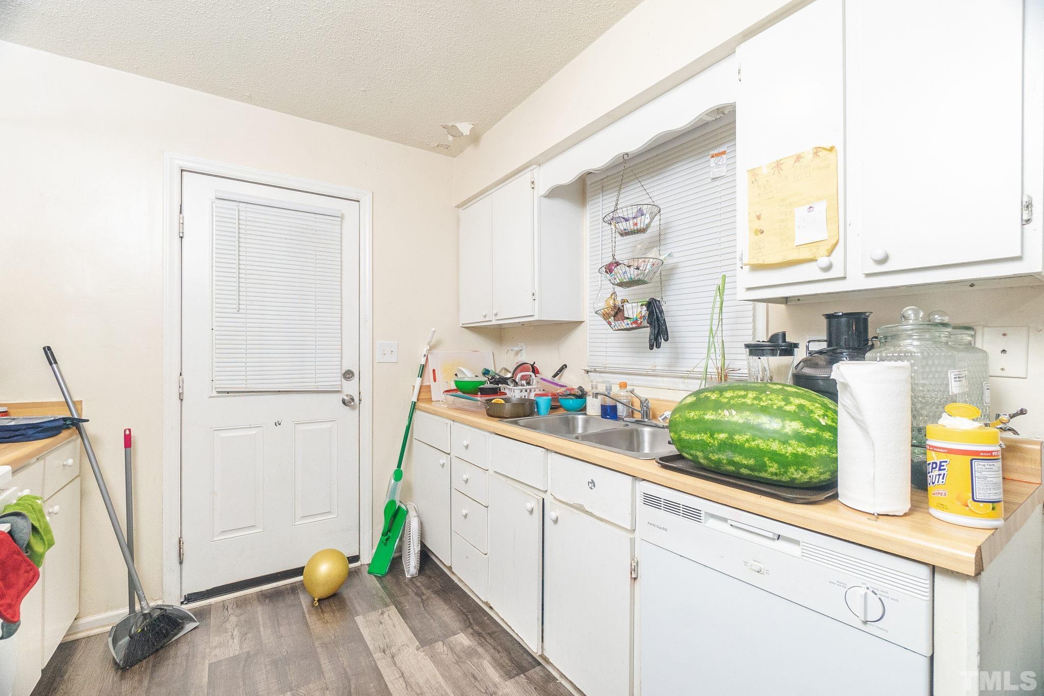 133 Bashford Road Raleigh, NC 27606 - Photo 18 of 45 a view of a kitchen with fridge and sink