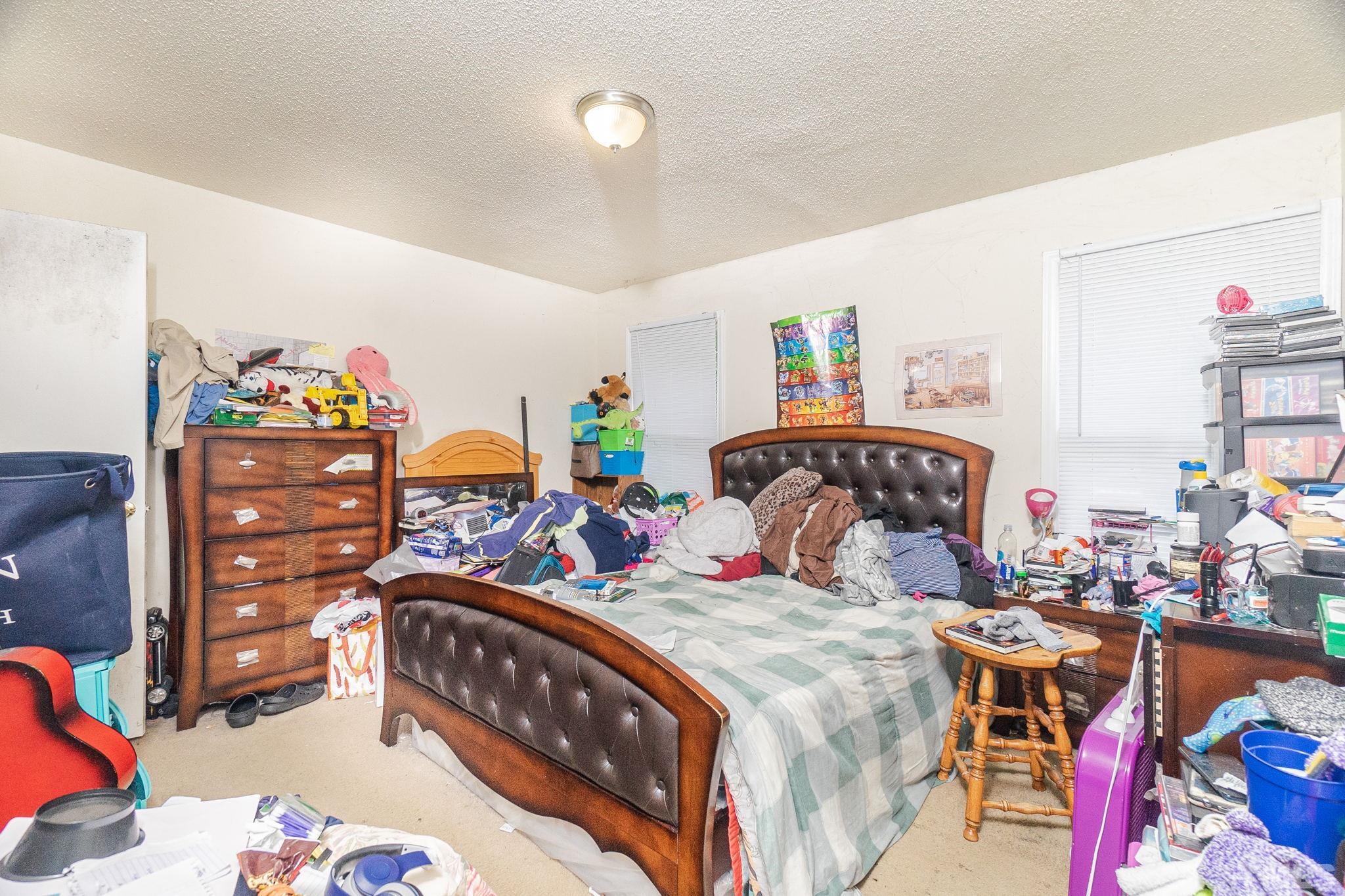 133 Bashford Road Raleigh, NC 27606 - Photo 31 of 45 a bedroom with two beds and a couch