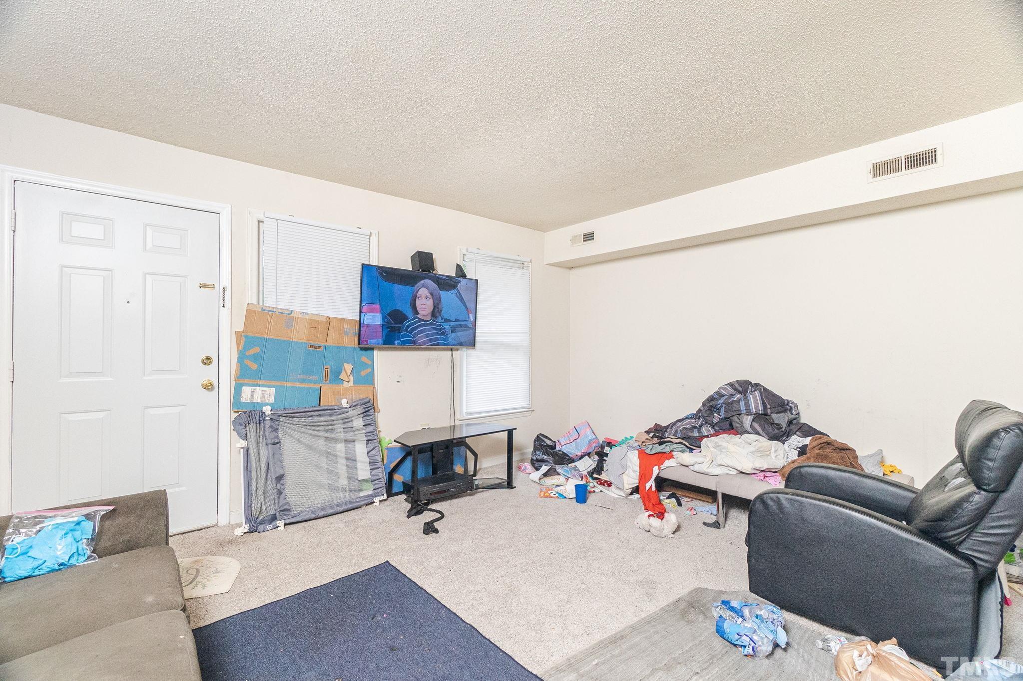 133 Bashford Road Raleigh, NC 27606 - Photo 34 of 45 a living room with furniture and a couch