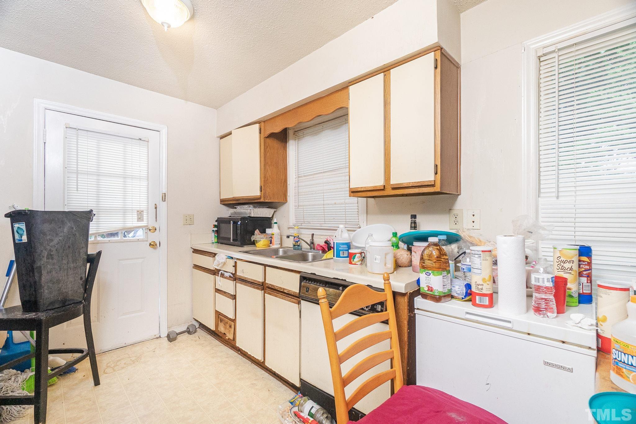 133 Bashford Road Raleigh, NC 27606 - Photo 36 of 45 a storage room with washer and dryer