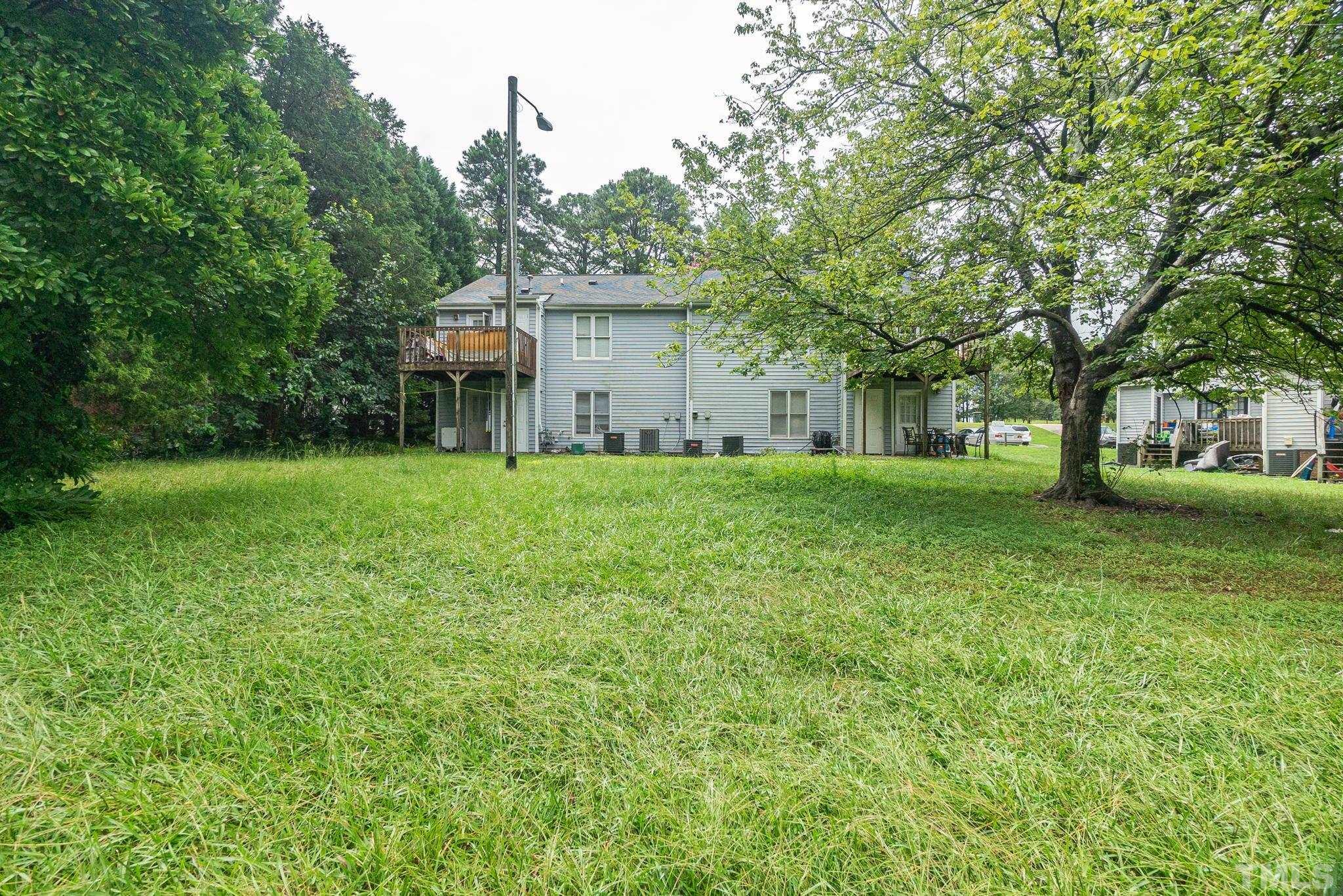 133 Bashford Road Raleigh, NC 27606 - Photo 40 of 45 a view of a house with a big yard and large trees