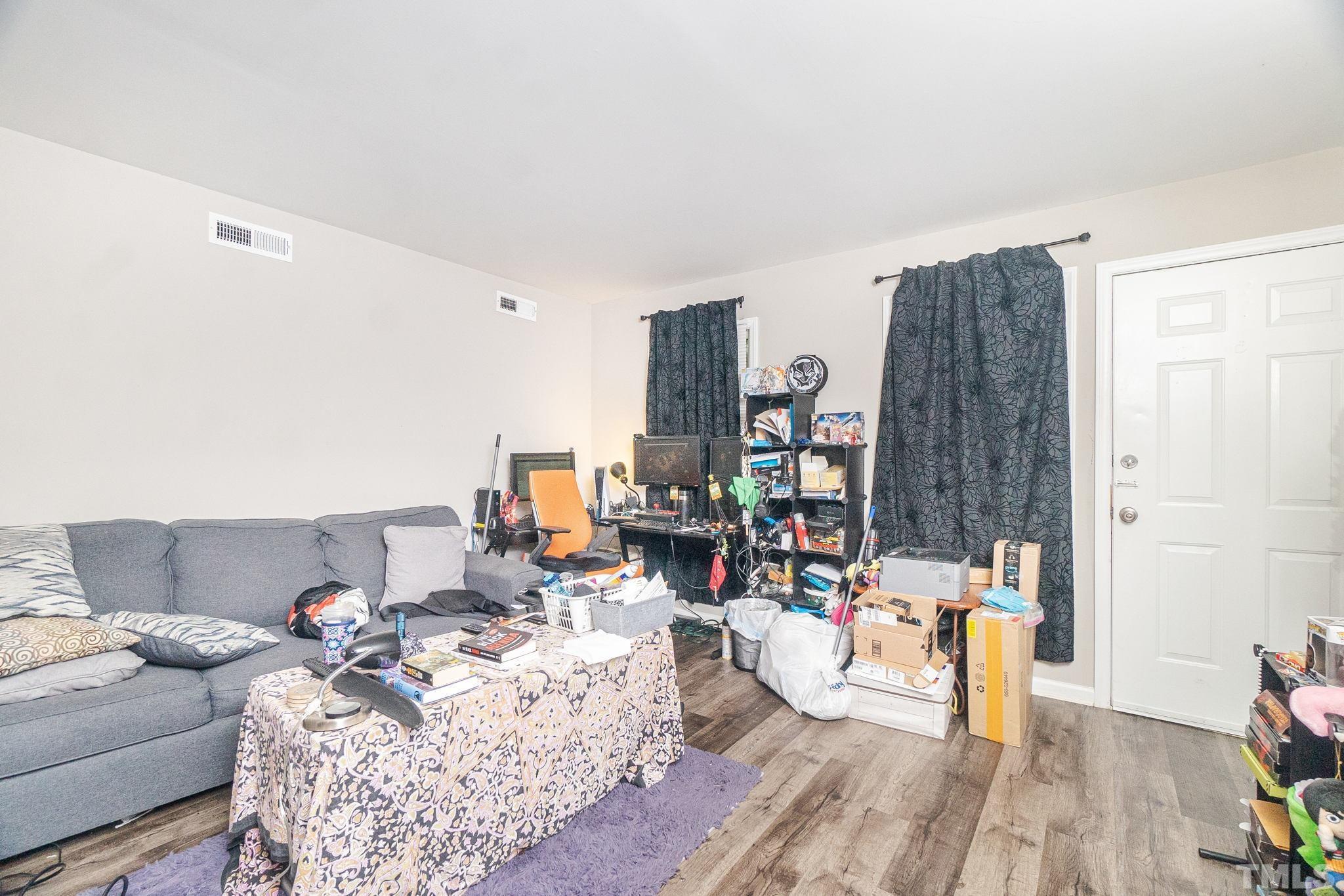 133 Bashford Road Raleigh, NC 27606 - Photo 7 of 45 a living room with furniture and a wooden floor