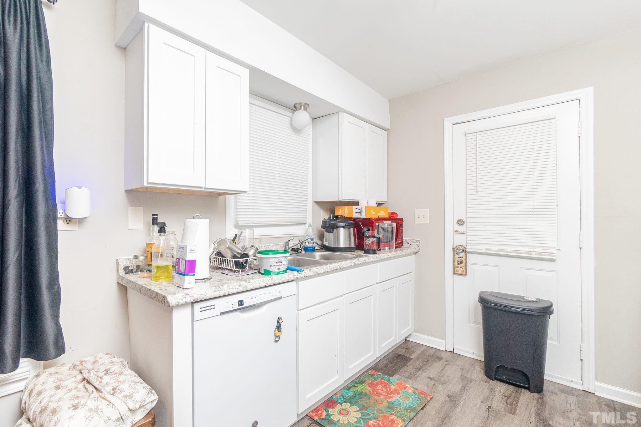133 Bashford Road Raleigh, NC 27606 - Photo 9 of 45 a utility room with cabinets washer and dryer