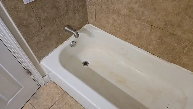 a bathroom with a white bath tub