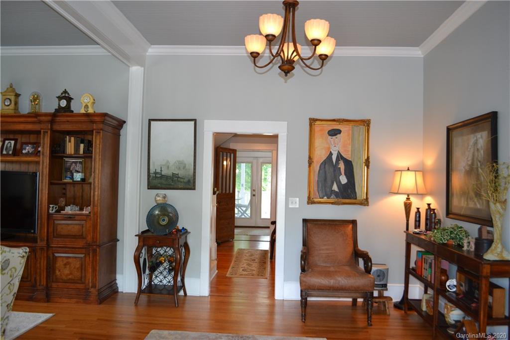 222 Maple Street Rutherfordton, NC 28139 - Photo 20 of 48 a view of a dining room with furniture wooden floor and a chandelier