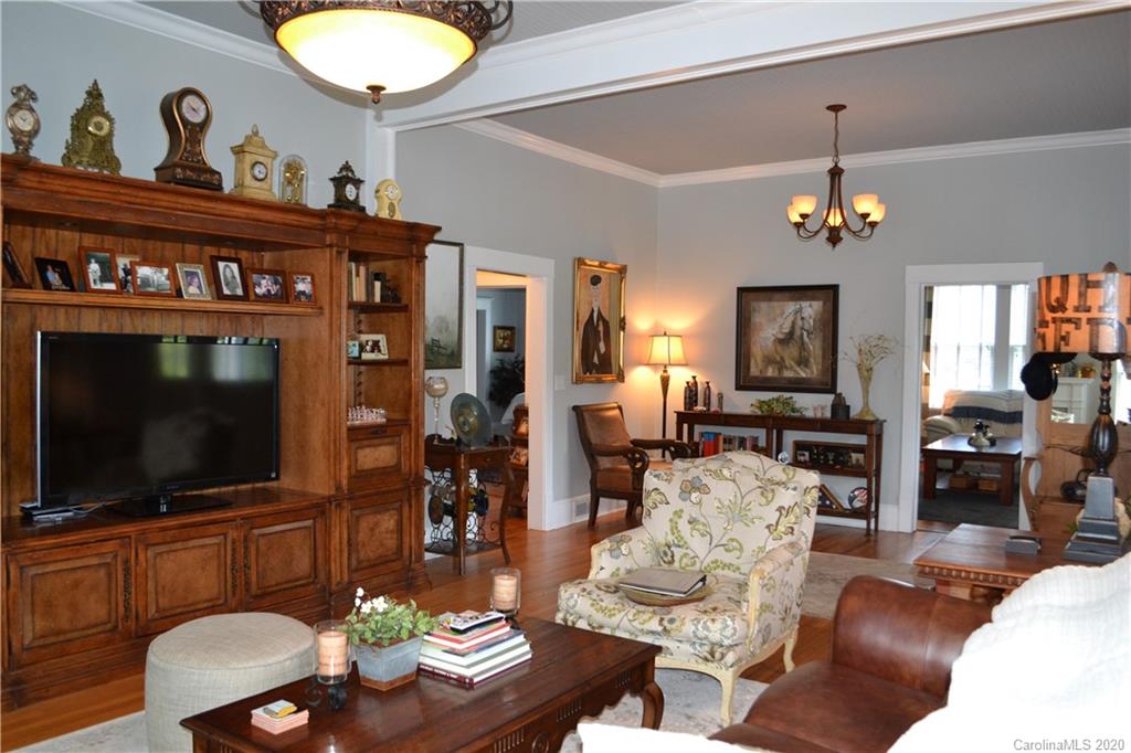 222 Maple Street Rutherfordton, NC 28139 - Photo 22 of 48 a living room with furniture a flat screen tv and kitchen view