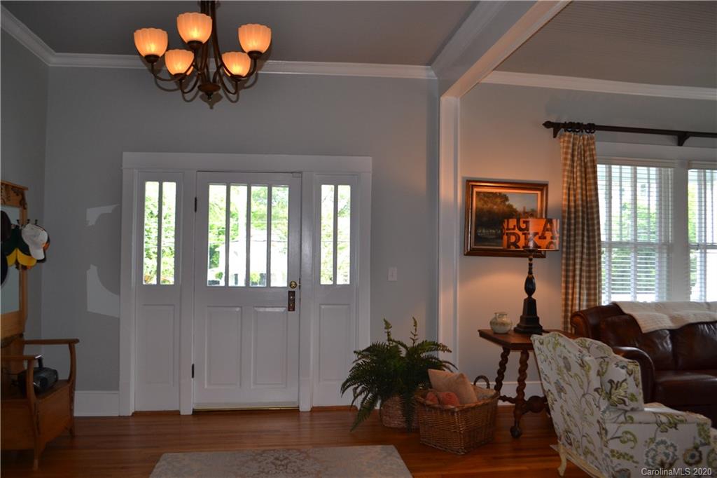 222 Maple Street Rutherfordton, NC 28139 - Photo 23 of 48 a living room with furniture a chandelier and a window