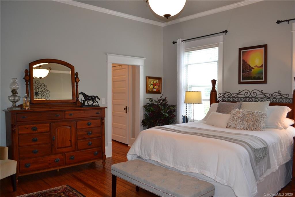 222 Maple Street Rutherfordton, NC 28139 - Photo 27 of 48 a bedroom with a bed and a dresser