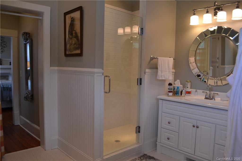 222 Maple Street Rutherfordton, NC 28139 - Photo 30 of 48 a bathroom with a sink mirror and vanity