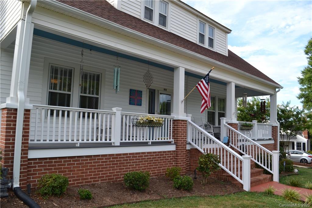 222 Maple Street Rutherfordton, NC 28139 - Photo 4 of 48 a view of a house with wooden fence and a porch