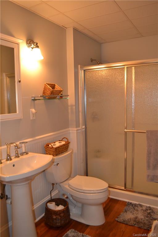 222 Maple Street Rutherfordton, NC 28139 - Photo 33 of 48 a bathroom with a sink a toilet and shower