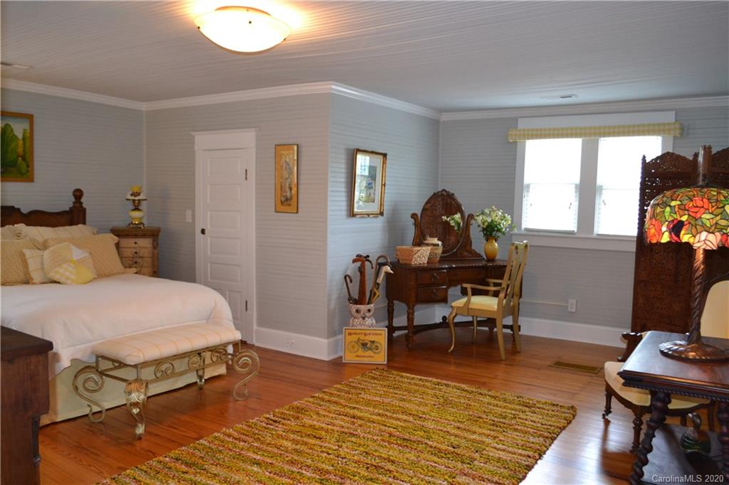 222 Maple Street Rutherfordton, NC 28139 - Photo 43 of 48 a bedroom with a bed and a desk