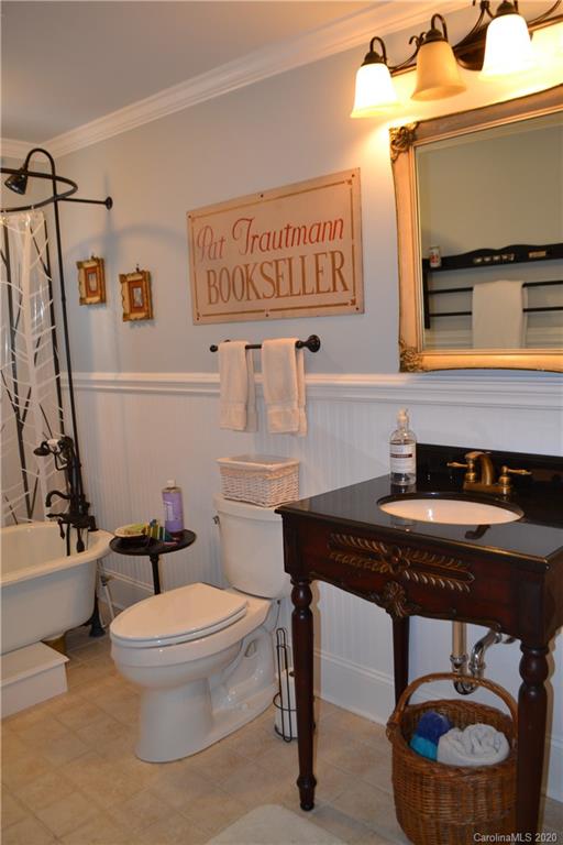 222 Maple Street Rutherfordton, NC 28139 - Photo 47 of 48 a bathroom with a toilet a sink and mirror