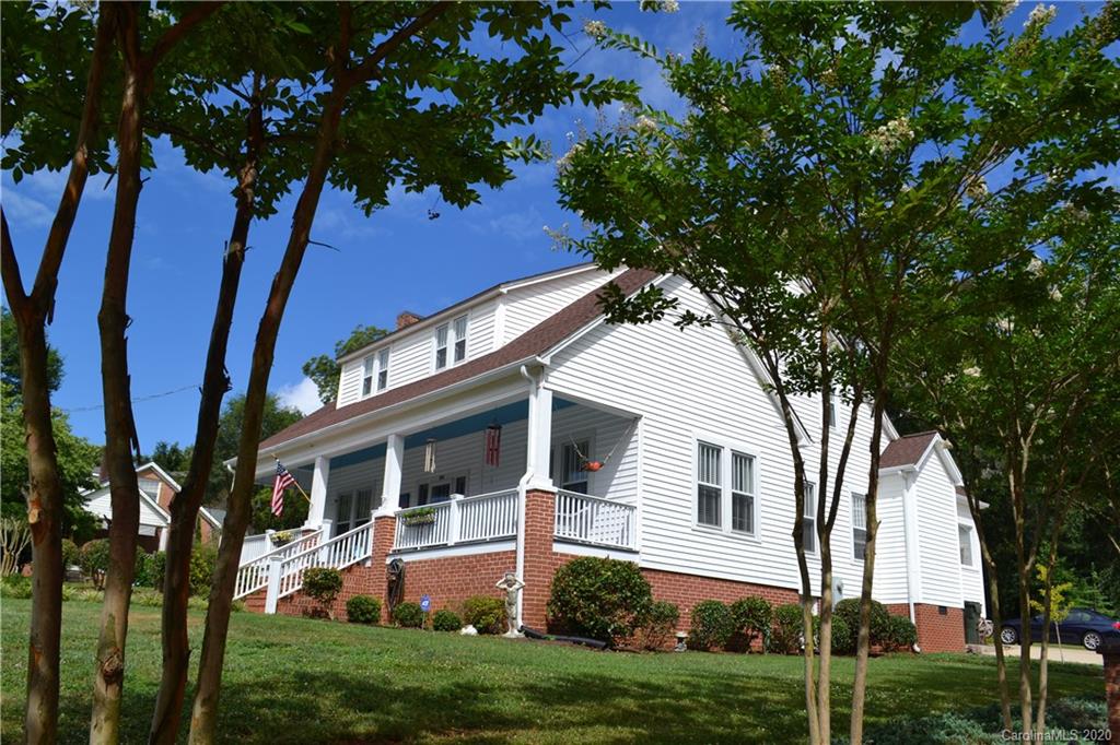 222 Maple Street Rutherfordton, NC 28139 - Photo 7 of 48 a front view of a house with a garden and trees