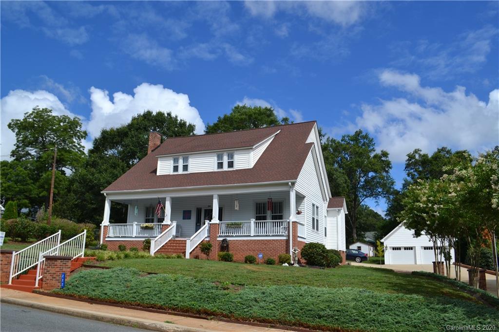 222 Maple Street Rutherfordton, NC 28139 - Photo 8 of 48 a front view of a house with garden and porch
