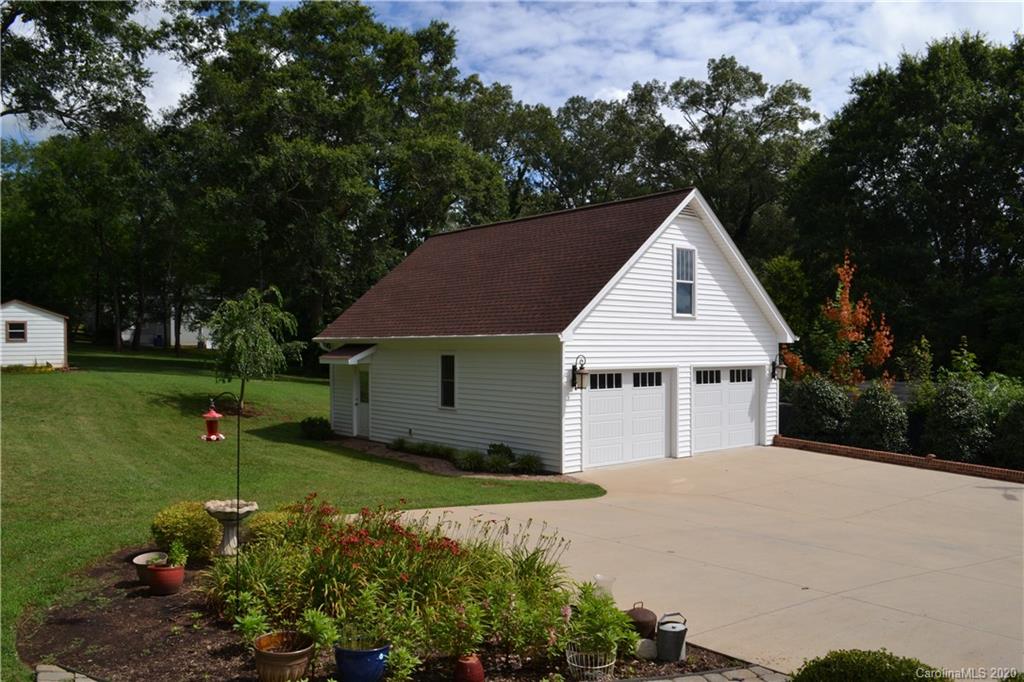 222 Maple Street Rutherfordton, NC 28139 - Photo 10 of 48 a view of a house with backyard and garden